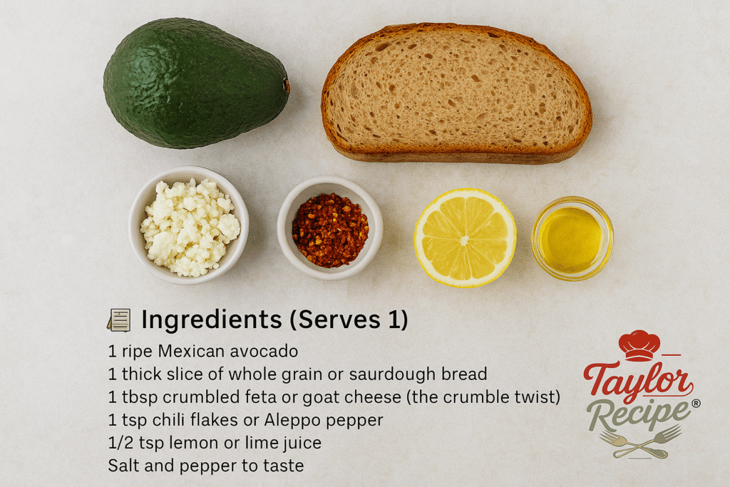 Top-down view of ingredients for avocado toast: a whole Mexican avocado, a slice of whole grain bread, crumbled feta cheese, chili flakes, lemon half, and a small bowl of olive oil, neatly arranged on a light background with 'Taylor Recipe' logo in the bottom right corner.